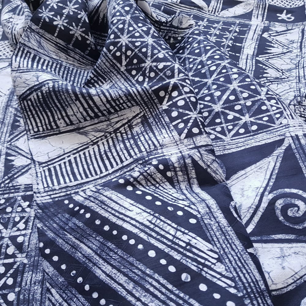 white abstract Yoruba patterns on dark blue Adire Fabric