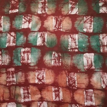 Teal and Coral Brushstrokes on Red Batik